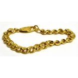 A 990 STANDARD GOLD BRACELET marked to clasp 'Asprey & Garrard', twisted double curb links with