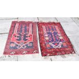 TWO HAND WOVEN RED GROUND PRAYER RUGS each 72cm x 110cm