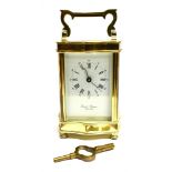 A FRENCH LACQUERED BRASS 8-DAY CARRIAGE CLOCK the enamel dial with Roman and Arabic numerals, signed