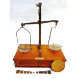 A SPRING BALANCE BY DE GRAVE, SHORT & CO., LONDON the mahogany base fitted with a drawer, 29cm