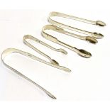 FOUR PAIRS OF SILVER SUGAR TONGS comprising a Georgian bright cut pair, hallmarked 1806 by Peter and
