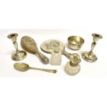 A GROUP OF SILVER ITEMS comprising a pair of silver dwarf candlesticks, silver backed cherub pattern