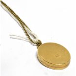 A 9 CARAT GOLD LOCKET AND CHAIN the oval locket with scroll and leaf pattern front, hallmarked to