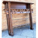 AN OAK OPEN BOOKCASE adapted from a fire surround, 170cm wide 29cm deep 149cm high