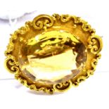 A VICTORIAN CITRINE SINGLE STONE SET YELLOW GOLD BROOCH the central citrine measuring approx. 22mm x