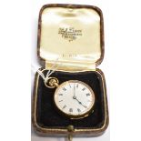 A LADIES 15 CARAT GOLD FOB/SMALL POCKET WATCH white enamel dial, roman numerals, top winding brass