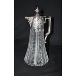 A MODERN SILVER TOPPED CUT GLASS CLARET JUG the lidded top with mask spout and handle and embossed