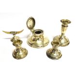 A SILVER CAPSTON INKWELL a small silver candlestick, a pair of dwarf candlesticks (as found) and a