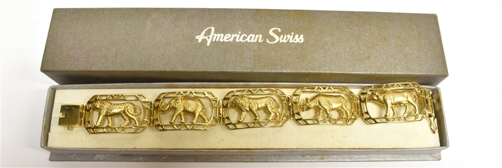 A 14 CARAT YELLOW GOLD SAFARI BRACELET comprising 5 openwork panels set with a leopard, elephant,