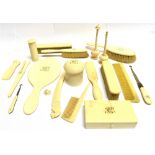 A GROUP OF VICTORIAN IVORY DRESSING TABLE ITEMS, including hand mirror, brushes, glove stretchers, a