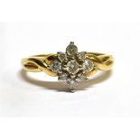 A DIAMOND CLUSTER 9 CARAT GOLD RING the offset square diamond cluster comprising nine small round