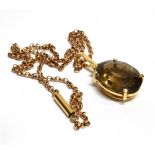 AN 18 CARAT GOLD SMOKY QUARTZ PENDANT to a gold belcher link chain, beryl snap clasp fastener,