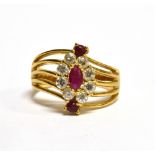 AN 18 CARAT GOLD RUBY AND WHITE STONE RING the oval cluster to open twist wirework shoulders, ring