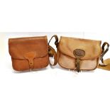 A LEATHER CARTRIDGE BAG with adjustable shoulder strap, width 26cm and a canvas Cartridge Bag with