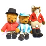 THREE SOFT TOYS one 'Little Folk' of a fox in hunt dress, 57cms high; and two teddy bears, one in