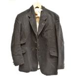 A GENTS BLACK 5 BUTTON HUNT COAT with check lining, size 40' approx