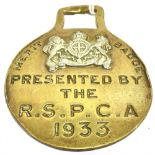 A SINGLE HORSE BRASS with a Coat of Arms and inscription 'Merit Badge, Presented by the R.S.P.C.A.