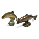 A CERAMICS FIGURE OF A LEAPING SALMON 18cm high, width 23cm and a resin fish figure, 15cm high, 31cm