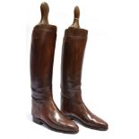 A PAIR OF LADY'S BROWN LEATHER HUNTING BOOTS with trees, approx size 4, by Moss Bros