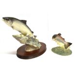 A BORDER FINE ARTS FIGURE OF A LEAPING SALMON no. 140, by David Walton, on an oval wooden base, 22cm