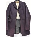 A LADY'S NAVY HUNT COAT with check lining, size 34' x long