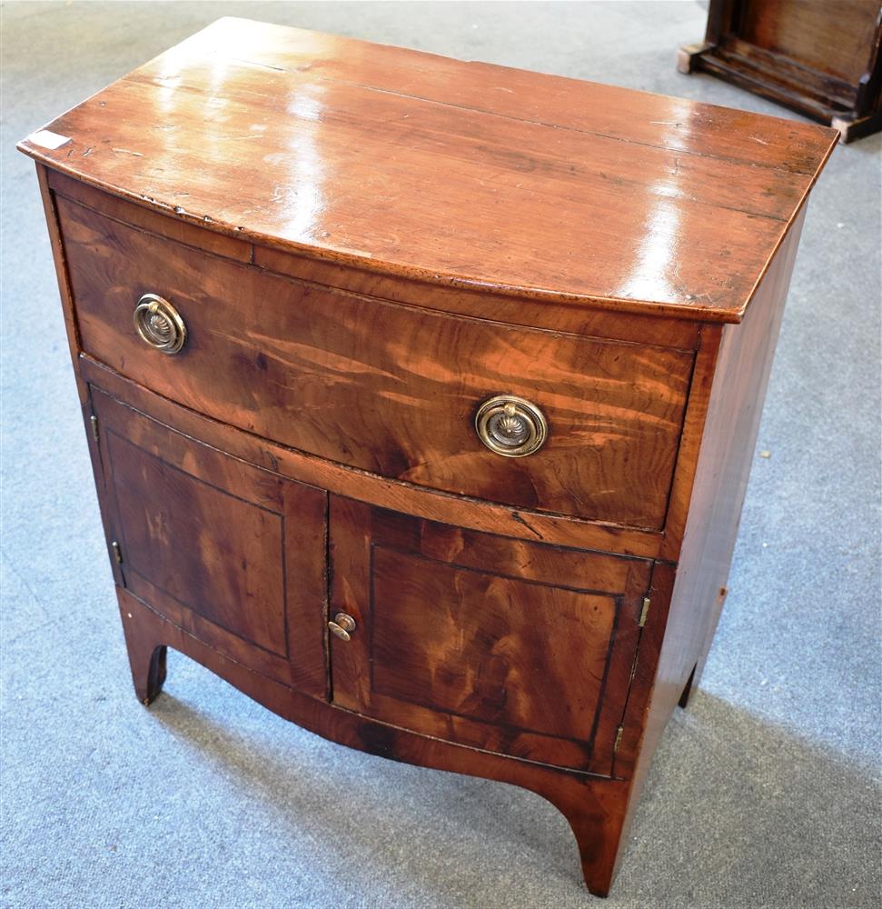 A GEORGE III MAHOGANY BOWFRONT COMMODE on bracket feet, 60cm wide 39cm deep 68cm high