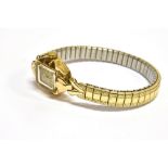 A LADIES VINTAGE 9CT GOLD ROTARY WRISTWATCH on a later plated expanding bracelet, small square dial,