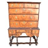 AN EARLY 18TH CENTURY WALNUT CHEST ON STAND with moulded cornice, the upper section with two short