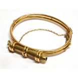 A 15 CARAT GOLD HINGED BANGLE WITH PROPELLING PENCIL ATTACHMENT the propelling pencil detachable