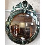 A VENETIAN STYLE WALL MIRROR 61cm diameter with shaped crest