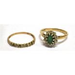 AN EMERALD AND WHITE STONE CLUSTER 9 CARAT GOLD DRESS RING ring size O, gross weight 2.3 grams,
