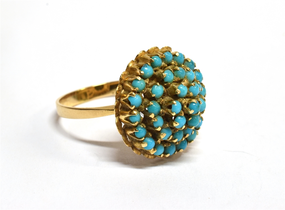 A TURQUOISE FOUR TIER ROUND CLUSTER YELLOW GOLD RING the cluster comprising small round cabochon cut