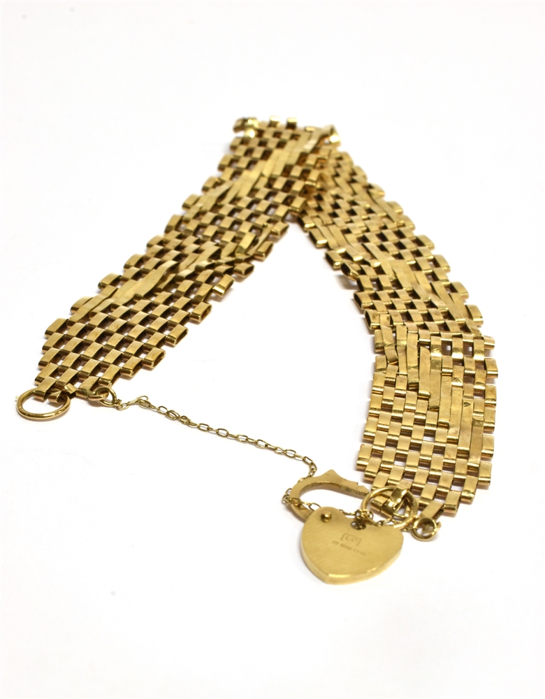 A 9 CARAT GOLD LINK 9 ROW BRACELET WITH FLAT PADLOCK FASTENER the bracelet with diagonal pattern