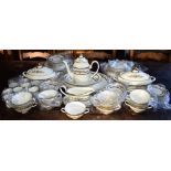 AN EXTENSIVE MINTON 'STANWOOD' PATTERN DINNER AND COFFEE SERVICE with floral decoration within a