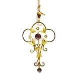 AN EDWARDIAN 9CT GOLD GARNET AND SEED PEARL SET PENDANT AND CHAIN the openwork pendant with scroll