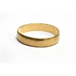A 9 CARAT GOLD PLAIN WEDDING BAND D profile with beaded edges, 5mm wide, ring size W, gross weight