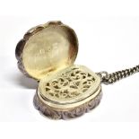 A VICTORIAN SILVER VINAIGRETTE the oval vinaigrette with scroll borders and scroll decoration,