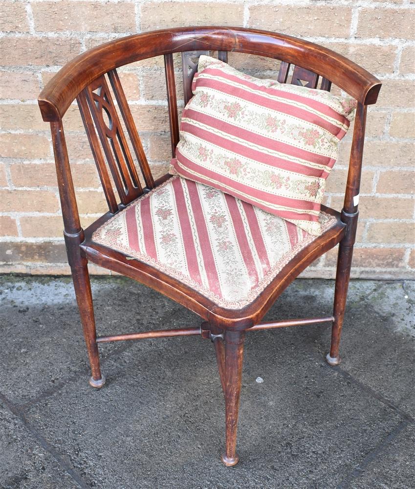 AN EDWARDIAN STAINED BEECH CORNER ARMCHAIR with line inlaid decoration