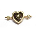 A VICTORIAN MOURNING BROOCH the heart shaped diamond, enamel and half pearl set front applied to bar
