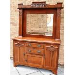 AN EDWARDIAN CARVED MAHOGANY MIRROR BACK SIDEBOARD the base with two central drawers above cupboard,