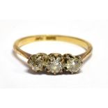 A DIAMOND THREE STONE 18 CARAT GOLD RING the three round old cut diamonds weighing approx. 0.66