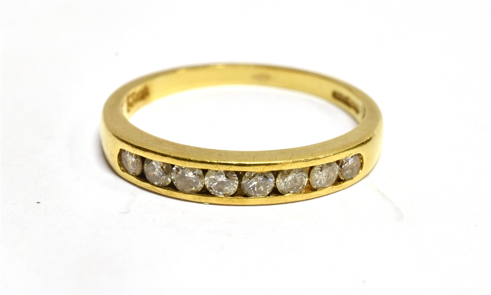 AN 18 CARAT GOLD HALF ETERNITY RING the front channel set section comprising eight small round - Image 2 of 2