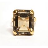 A LARGE SMOKY QUARTZ SINGLE STONE 9 CARAT GOLD DRESS RING the rectangular cut corner smoky quartz