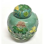 A CHINESE GINGER JAR AND COVER with relief decoration of a crane and foliage, seal type raised