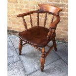 A SMOKERS BOW ARMCHAIR stamped 'JOYNSON HOLLAND MAKERS WYCOMBE 1904'