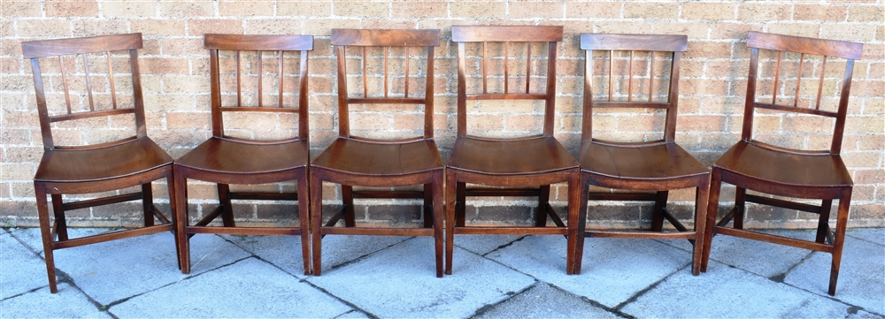 A SET OF SIX PROVINCIAL MAHOGANY DINING CHAIRS with curved backrails and shaped solid seats, on