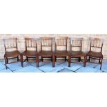 A SET OF SIX PROVINCIAL MAHOGANY DINING CHAIRS with curved backrails and shaped solid seats, on