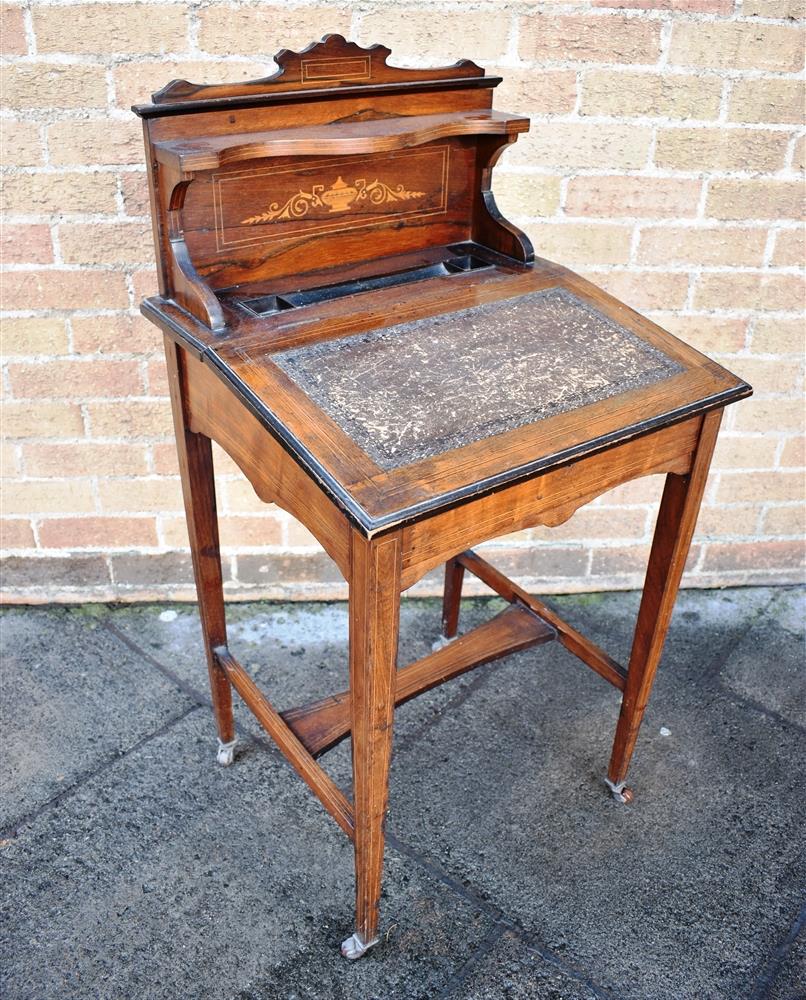 AN EDWARDIAN ROSEWOOD DESK with marquetry inlaid decoration, on square tapering supports with