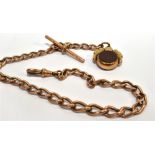 A VICTORIAN 9 CARAT ROSE GOLD ALBERT CHAIN with bloodstone and carnelian set swing fob, toggle