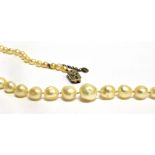 A SINGLE ROW PEARL NECKLACE WITH DIAMOND CLASP the graduating baroque shaped pearls measuring